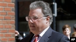 FILE - In this April 3, 2019 file photo, Manuel Henriquez arrives at federal court in Boston to face charges in a nationwide college admissions bribery scandal. Henriquez was scheduled on July 29, 2020, to six months in prison.