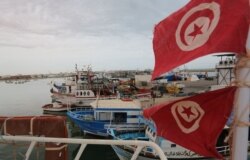 Tunisian fishermen prepare their nets in the port of Zarzis in the southern coast of Tunisia, May 21, 2019. Tunisian fishermen are finding themselves more involved in rescuing illegal boats leaving Libya for Italy.
