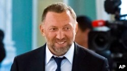 FILE - Russian metals magnate Oleg Deripaska attends a meeting of Russian President Vladimir Putin and Turkish President Recep Tayyip Erdogan, outside St. Petersburg, Russia, Aug. 9, 2016. 