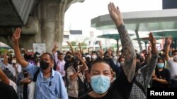 Demonstrators react after Thailand's Constitutional Court delivers its verdict on suspended Prime Minister Prayuth Chan-ocha's tenure, in Bangkok, Thailand, Sept. 30, 2022. 