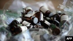 FILE - Glass capsules containing ketamine are seen in Thailand in 2008.