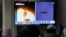  A TV screen shows file images of a North Korean missile launch during a news program at the Seoul Railway Station in Seoul, South Korea, Oct. 13, 2022. 