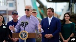 President Joe Biden speaks Oct. 5, 2022, after touring an area impacted by Hurricane Ian in Fort Myers Beach, Fla.