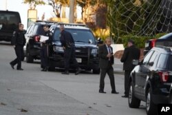 Police investigators work outside the home of Paul Pelosi, the husband of House Speaker Nancy Pelosi, in San Francisco
