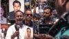A man holding a photo of his brother, an alleged victim of an enforced disappearance, is overcome with emotions during a rally in Dhaka, Aug. 30, 2022. At the rally, families of dozens of victims turned up with photos of missing activists. (Abdur Rajjak/VOA)