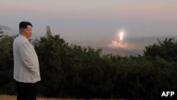 File - This undated photo from North Korea's Korean Central News Agency on Oct. 10, 2022, shows North Korea's leader Kim Jong Un monitoring a North Korean missile launch from an undisclosed location. KCNA said he oversaw the launch of two long-range strategic cruise missiles.