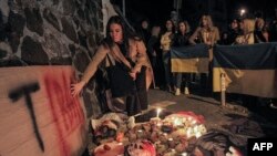 People demonstrate outside the Iranian embassy in Ukraine on Oct. 17, 2022, in Kyiv, after the city was hit by swarms of kamikaze drones sold by Iran to Russia.