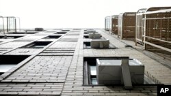 FILE - Window air conditioners are pictured in New York. The U.S. Senate on Sept. 21, 2022, ratified a pact that compels countries to limit use of hydrofluorocarbons – greenhouse gases used in refrigeration and air conditioning that are far more powerful than carbon dioxide. 