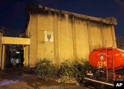 In this photo provided by Islamic Republic News Agency, IRNA, on Oct. 16, 2022, a charred building is seen after a fire on the property of Evin Prison, in Tehran, Iran.