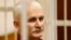 FILE - Ales Bialiatski, the head of Belarusian Vyasna rights group, stands in a defendants' cage during a court session in Minsk, Belarus, on Nov. 2, 2011. He was named one of three recipients of the 2022 Nobel Peace Prize on Oct. 7, 2022, and is in prison again.