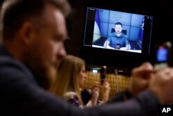 Ukrainian President Volodymyr Zelenskyy speaks during a video address to the European Council, on Oct. 13, 2022, in Strasbourg, eastern France. Ukraine's capital region was struck by Iranian-made kamikaze drones early Thursday, officials said, sending re