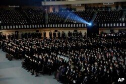 Hundreds of guests attend the state funeral for slain former Prime Minister Shinzo Abe, Tuesday, Sept. 27, 2022, in Tokyo. (Leah Millis/Pool Photo via AP)