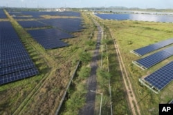 A solar power plant in Pavagada Tumkur district, in the southern Indian state of Karnataka, India, Sept. 15, 2022. The key priority for India at the upcoming U.N. climate conference will be how to pay for the transition away from fossil fuels for energy and industries to meet temperature limit targets, according to a senior official who'll be part of the negotiations.