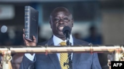 FILE - Incoming Kenyan Deputy President Rigathi Gachagua takes the oath of office at the Moi International Sports Center Kasarani in Nairobi, Kenya, Sept. 13, 2022.