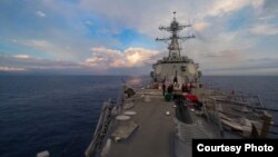 The Arleigh-burke class guided-missile destroyer USS Dewey (DDG 105) transits the South China Sea, May 6, 2017.