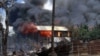 Smokes and flames billow from burning buildings in Sittwe, capital of Rakhine state in western Burma, where sectarian violence is ongoing, June 12, 2012.