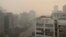 Buildings are seen enveloped by smog and haze in New Delhi, India, Nov. 4, 2022.