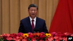 FILE - Chinese President Xi Jinping delivers his speech at a dinner marking the 75th anniversary of the founding of the People's Republic of China, at the Great Hall of the People in Beijing, Sept. 30, 2024. 