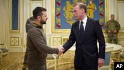 FILE - Ukrainian President Volodymyr Zelenskyy, left, and White House national security adviser Jake Sullivan shake hands during their meeting in Kyiv, Ukraine, Nov. 4, 2022. (Ukrainian Presidential Press Office via AP)