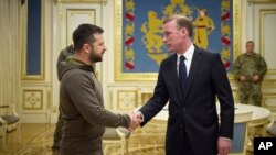 Ukrainian President Volodymyr Zelenskyy, left, and White House national security adviser Jake Sullivan shake hands during their meeting in Kyiv, Ukraine, Nov. 4, 2022. (Ukrainian Presidential Press Office via AP)