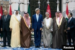 (L to R) Egypt's Foreign Minister is joined by counterparts from Kuwait, Saudi Arabia, the U.S., Oman, Bahrain, and Lebanon at King Abdulaziz International Airport’s Royal Terminal in Jeddah, Sept. 11, 2014.