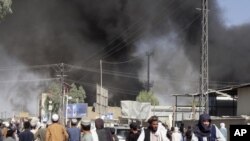 Smoke rises after fighting between the Taliban and Afghan security personnel in the city of Kandahar, southwest of Kabul, Afghanistan, Thursday, Aug. 12, 2021. (AP Photo/Sidiqullah Khan)