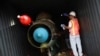 FILE - Panamanian forensic workers in a container holding a MiG-21 fighter jet seized from the North Korean-flagged ship Chong Chon Gang at the Manzanillo Container Terminal in Colon city, July 21, 2013.