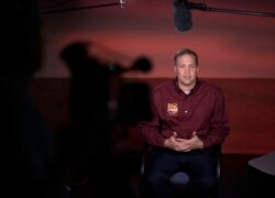 FILE - NASA Administrator Jim Bridenstine talks to multiple media outlets at NASA's Jet Propulsion Laboratory in Pasadena, California, Nov. 26, 2018.