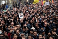 Protesters demonstrate over the U.S. airstrike in Iraq that killed Iranian Revolutionary Guard Gen. Qassem Soleimani in Tehran, Iran, Jan. 4, 2020.