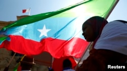 FILE - Members of the Oromo community of Ethiopia, living in Malta, protest against the Ethiopian regime and its plan to displace Oromo farmers outside the office of Malta's Prime Minister in Valletta, June 16, 2014.