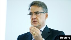 In this file photo, International Air Transport Association (IATA) Director General and CEO Alexandre de Juniac speaks during Global Media Day in Geneva, Dec. 5, 2017.