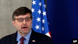 FILE - Matthew Palmer, deputy assistant secretary at U.S. Department of State-Bureau of European and Eurasian Affairs, speaks during a press conference after talks with Serbian President Aleksandar Vucic in Belgrade, Serbia, Oct. 19, 2018.