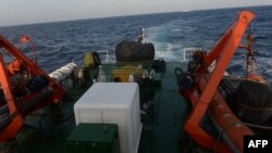 FILE - Image from a Vietnam Coast Guard ship on May 13, 2014 shows a covered gun-machine on the deck during a patrol near China's oil drilling rig in disputed waters in the South China Sea. 