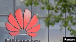 FILE PHOTO: Signage is seen at the Huawei offices in Reading, Britain, May 2, 2019. REUTERS/Toby Melville