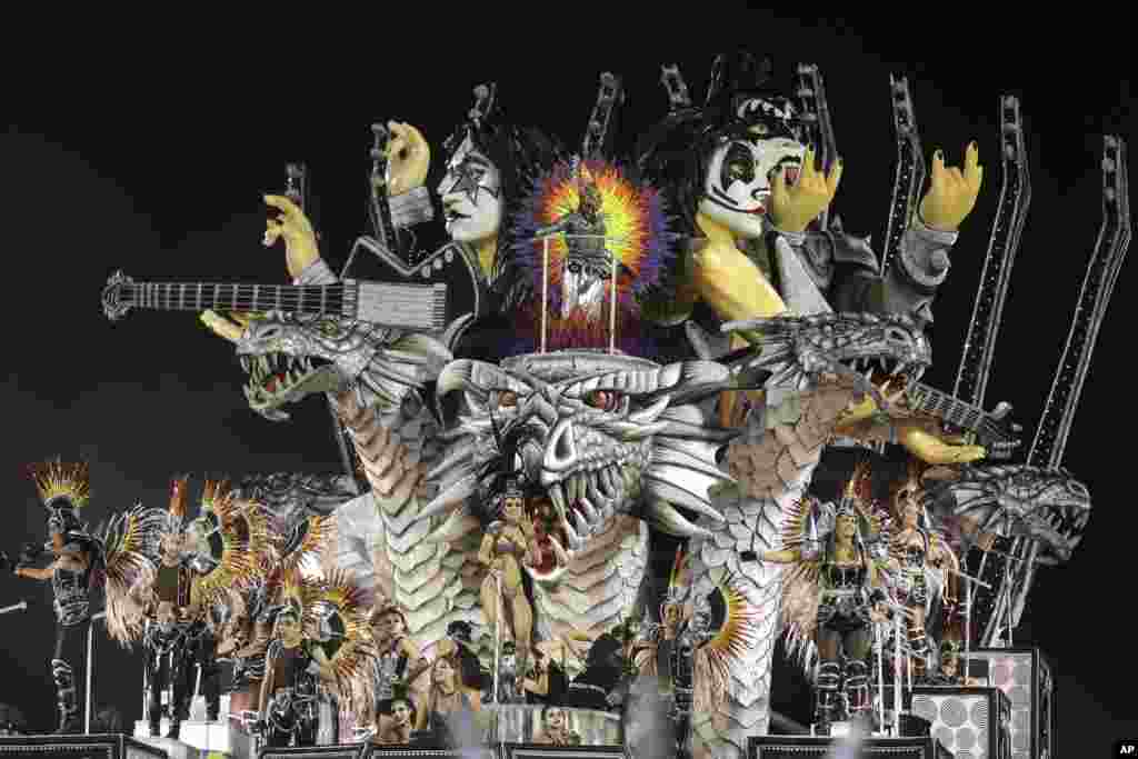 Dancers from the Dragoes da Real samba school perform on a float during a carnival parade in Sao Paulo, Brazil.