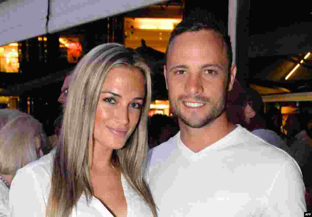 Olympian runner Oscar Pistorius posing next to his girlfriend Reeva Steenkamp at Melrose Arch in Johannesburg, Jan. 26, 2013.