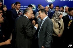 Members of parliament, who held a sit-in overnight inside the parliament building, gather during a news conference, in Baghdad, Iraq, April 13, 2016.