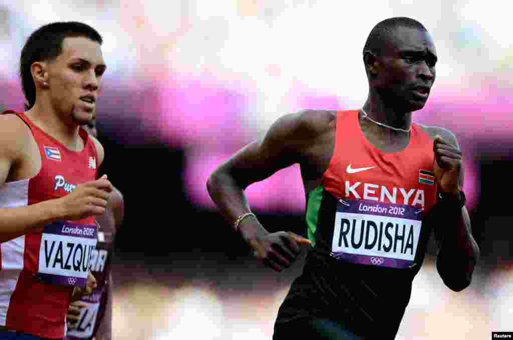 David Lekuta Rudisha (right), of Kenya, runs ahead of Puerto Rico's Wesley Vazquez. Rudisha shattered his own world record in the fastest ever 800m race.