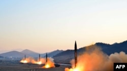 រូប​ភាព​មួយ​ដែល​បាន​ផ្តល់​ដោយ​ទីភ្នាក់ងារ​សារព័ត៌មាន​កូរ៉េខាងជើង​ (KCNA) កាល​ពី​ថ្ងៃទី​០៧ មីនា​​២០១៧ បង្ហាញ​ពី​ការ​បាញ់​កាំជ្រួច​មីស៊ីលដោយ​កងទ័ព​ប្រជាជន​កូរ៉េ (KPA) ក្នុង​ការ​ធ្វើ​សមយុទញធ​យោធា​មួួ​នៅ​ក្នុងតំបន់​សម្ងាត់​មួយ​នៅ​ប្រទេស​កូរ៉េ​ខាង​ជើង។undisclosed location in North Korea.