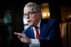 FILE - Ohio Governor Mike DeWine speaks during an interview at the Governor's Residence in Columbus, Ohio, Dec. 13, 2019.