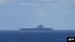 FILE - This handout photo taken on July 9, 2024 and released on July 10 by Japan's Ministry of Defense shows the Chinese navy's aircraft carrier Shandong in the Pacific Ocean southeast of Miyakojima, Okinawa prefecture.