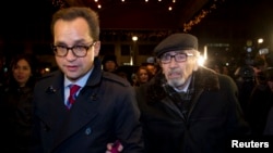 Boris Khodorkovsky (R), father of Russian former oil tycoon Mikhail Khodorkovsky, arrives to hotel Adlon in Berlin, Dec. 21, 2013. 