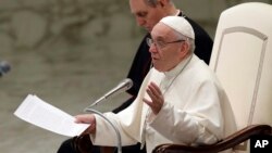 Pope Francis talks during the weekly general audience in the Paul VI Hall at the Vatican, March 7, 2018. 
