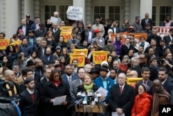New York City Council Speaker Melissa Mark-Viverito, center, speaks during an interfaith rally at New York's City Hall in response to Republican presidential candidate Donald Trump's call to block Muslims from entering the U.S., Dec. 9, 2015.