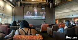 Students watch the hearing of U.S. Supreme Court nominee Brett Kavanaugh at the Walter Cronkite School of Journalism and Mass Communication at Arizona State University, Phoenix, Sept. 27, 2018.