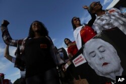 Demonstrators take part in a mock funeral for Brazil's President Michel Temer, during an anti-government protest in Brasilia, May 24, 2017.