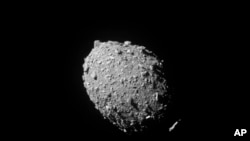 This image provided by NASA shows the asteroid Dimorphos, captured by NASA’s DART mission just two seconds before the spacecraft struck its surface, on Sept. 26, 2022. (NASA/Johns Hopkins APL via AP)
