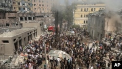 Rescuers and volunteers clean up the rubble and search for victims after a Russian missile hit the country's main children's hospital, Okhmadit in Kyiv, Ukraine, July 8, 2024. 
