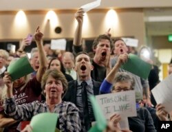 People shout to Rep. Jason Chaffetz during his town hall meeting at Brighton High School in Cottonwood Heights, Utah, Feb. 9, 2017. In an echo of the raucous complaints that confronted Democrats back in 2009 as they worked to pass "Obamacare" in the first place, Republicans who want to repeal it now are facing angry pushback of their own at constituent gatherings from Utah to Michigan to Tennessee and elsewhere, even in solidly Republican districts.
