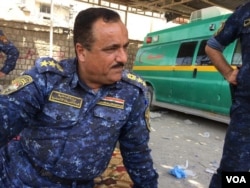 Iraqi Federal Police Col. Taha al-Hussaini says families are screened several times as forces look for bombs, weapons and militants attempting to flee, in Mosul, Iraq, July 3, 2017. (H. Murdock/VOA)
